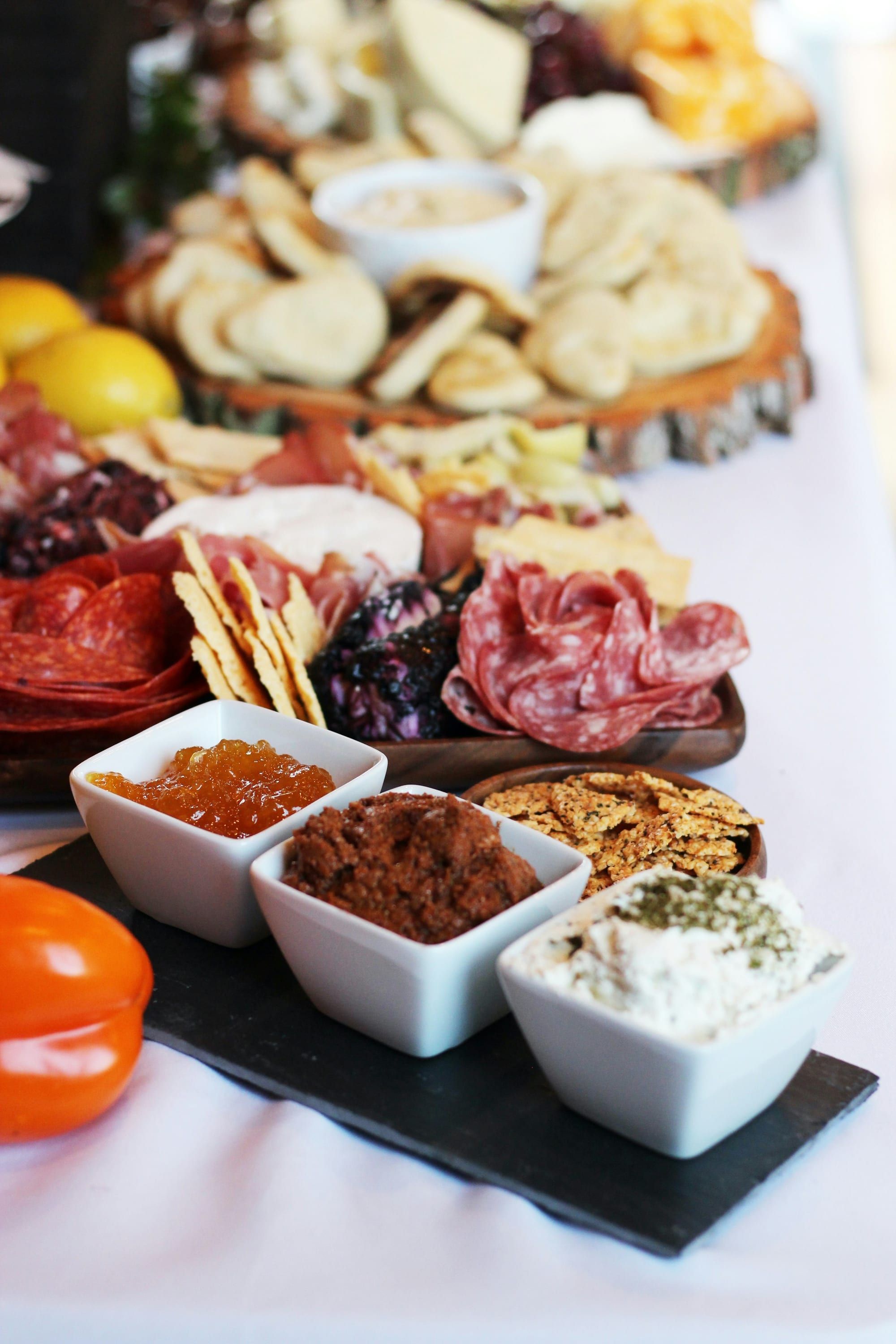 Cheese, crackers, and strawberries on a board
