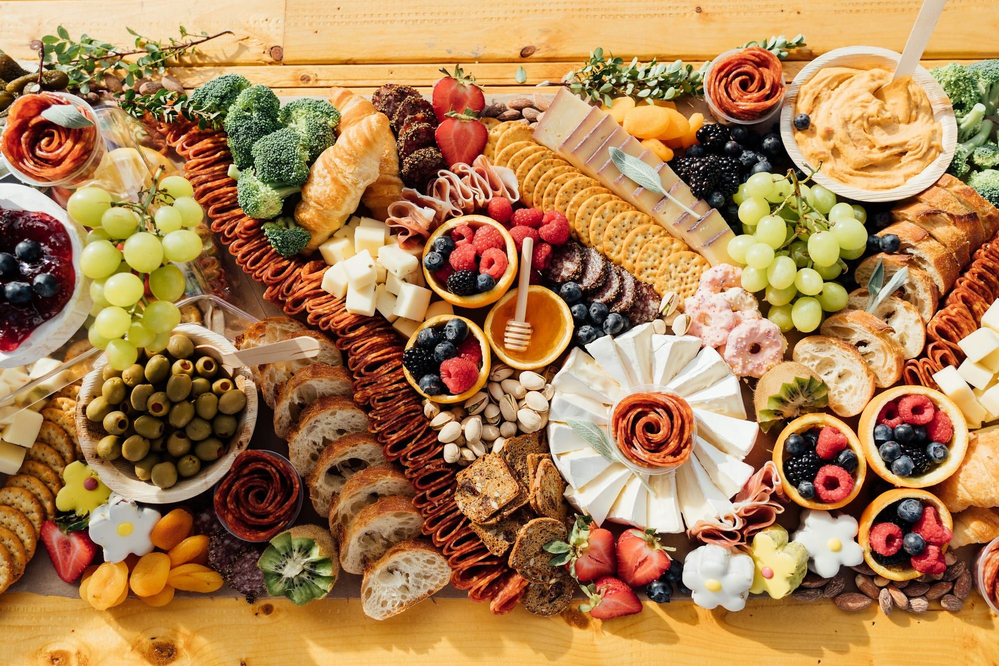 A charcuterie board of cheeses, cured meats, and fruit