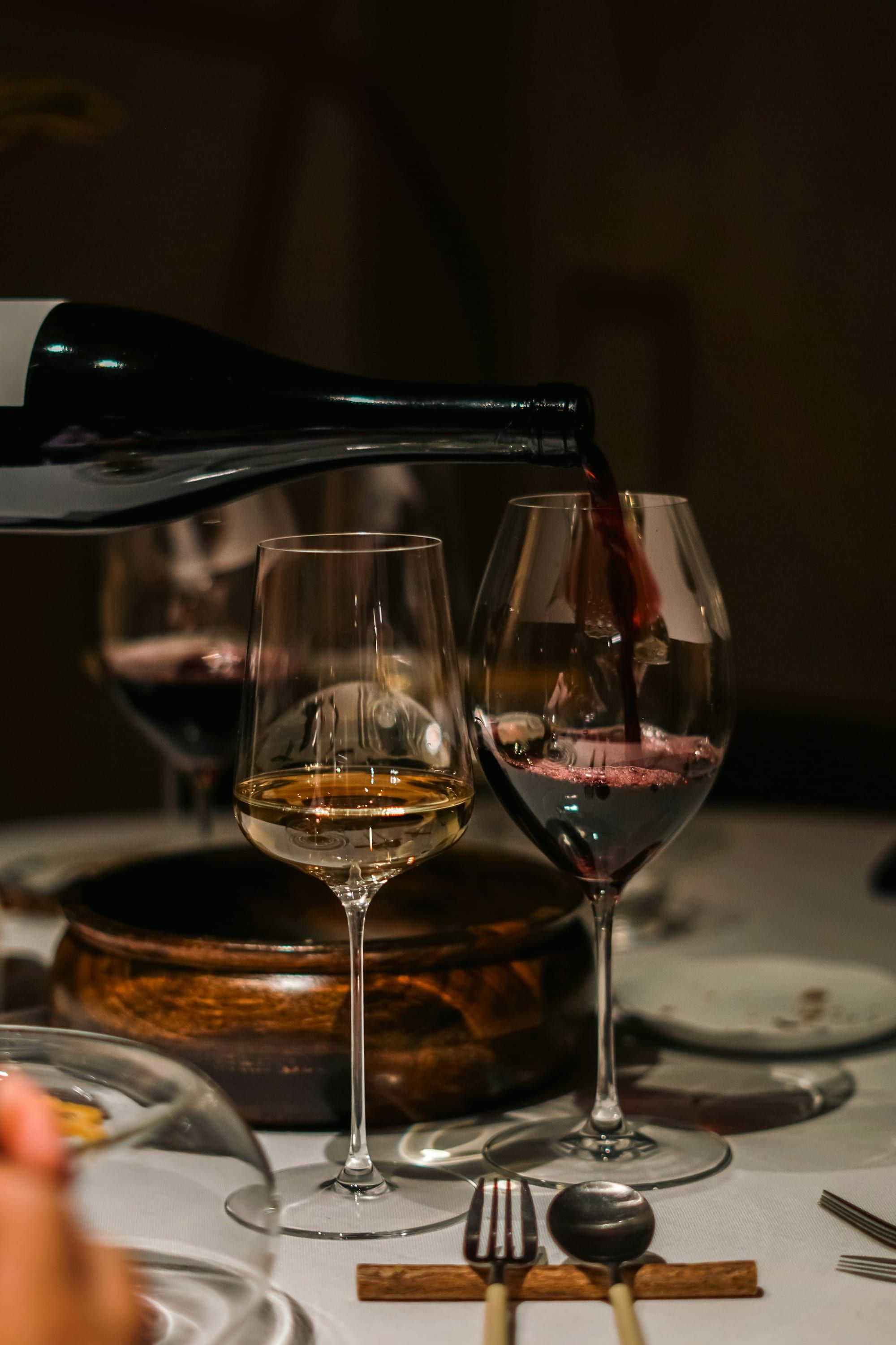 Wine poured tableside into two glasses