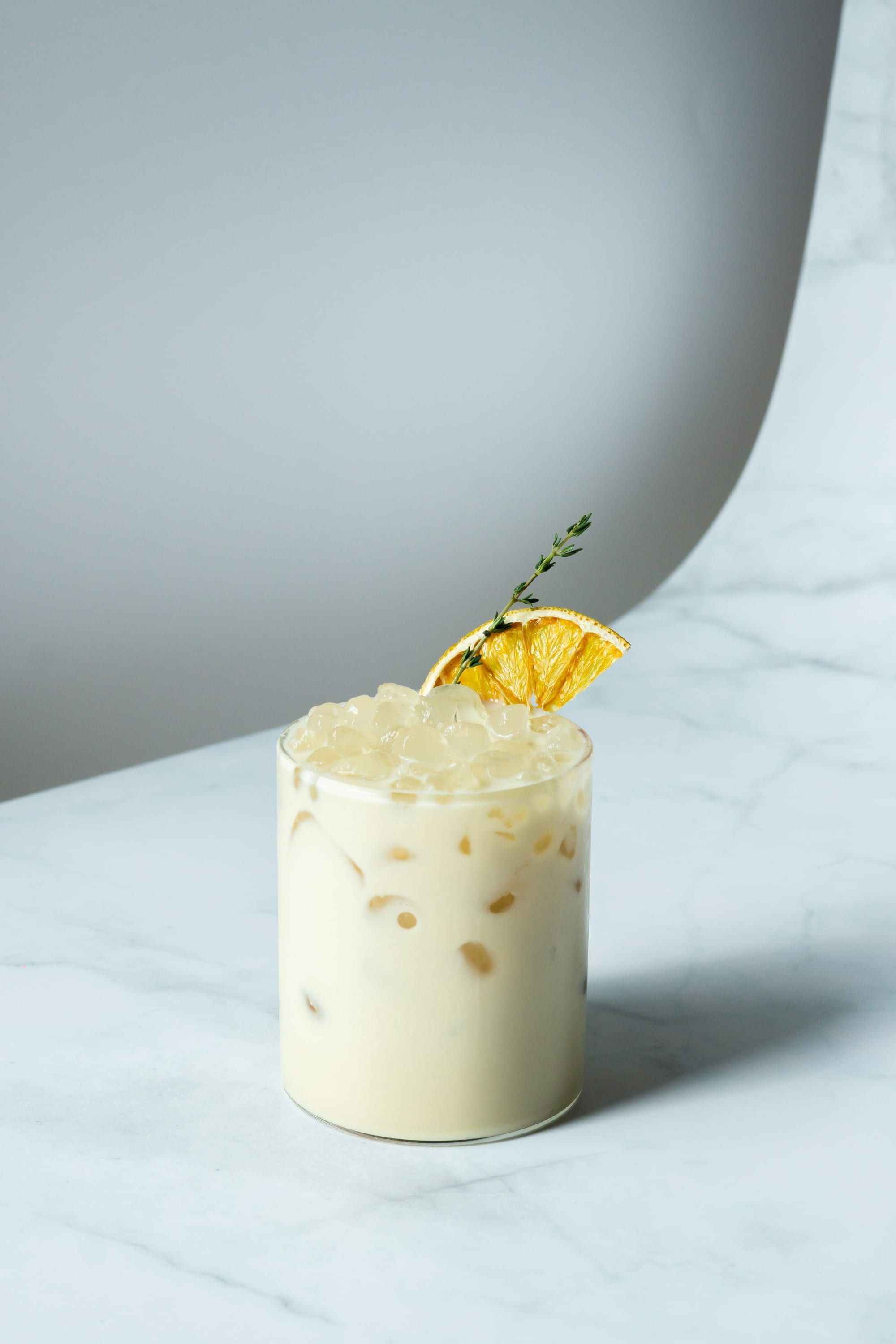 A cocktail finished with an edible flower
